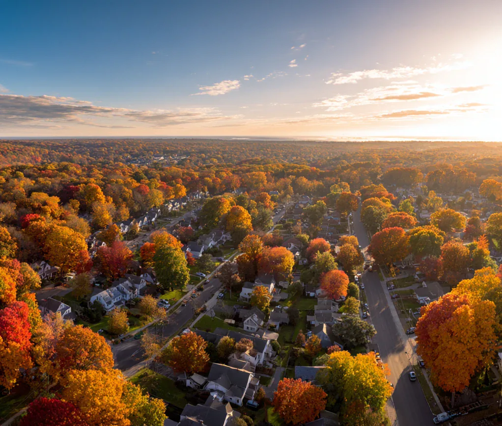 Aerial view of a Norwalk, Connecticut neighborhood surrounded by colorful fall foliage